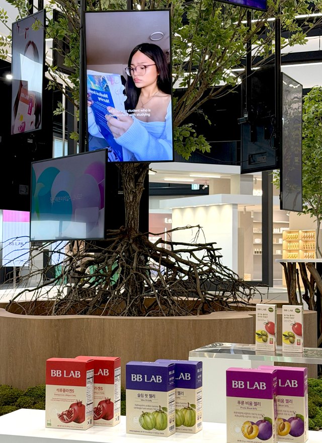 BB LAB products displayed under screens at the WellLink Studio