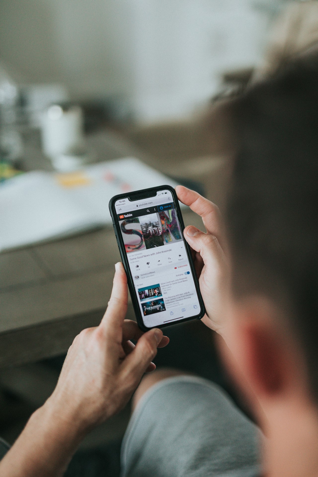 A creator holding a phone, filming content for a brand campaign