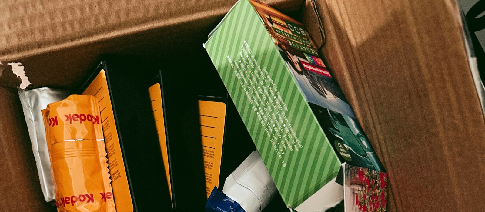 An opened shipping box filled with product a creator received